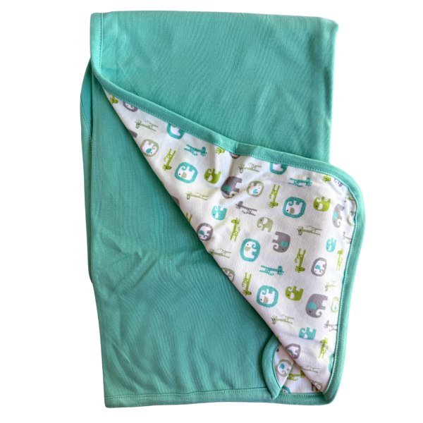 Manta Reversible Minime - Turquesa / Elefantes y jirafas